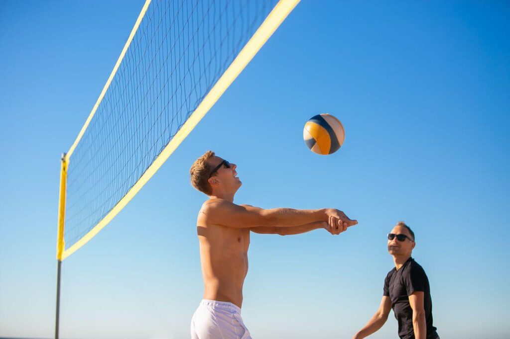Couple of people playing beach volleyball in North Pacific Beach