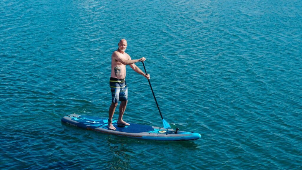 A man paddleboarding in North Pacific Beach