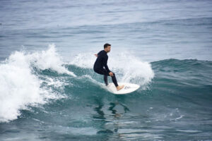 Surfer riding a wave in North Pacific Beach